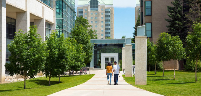 two people walking on campus