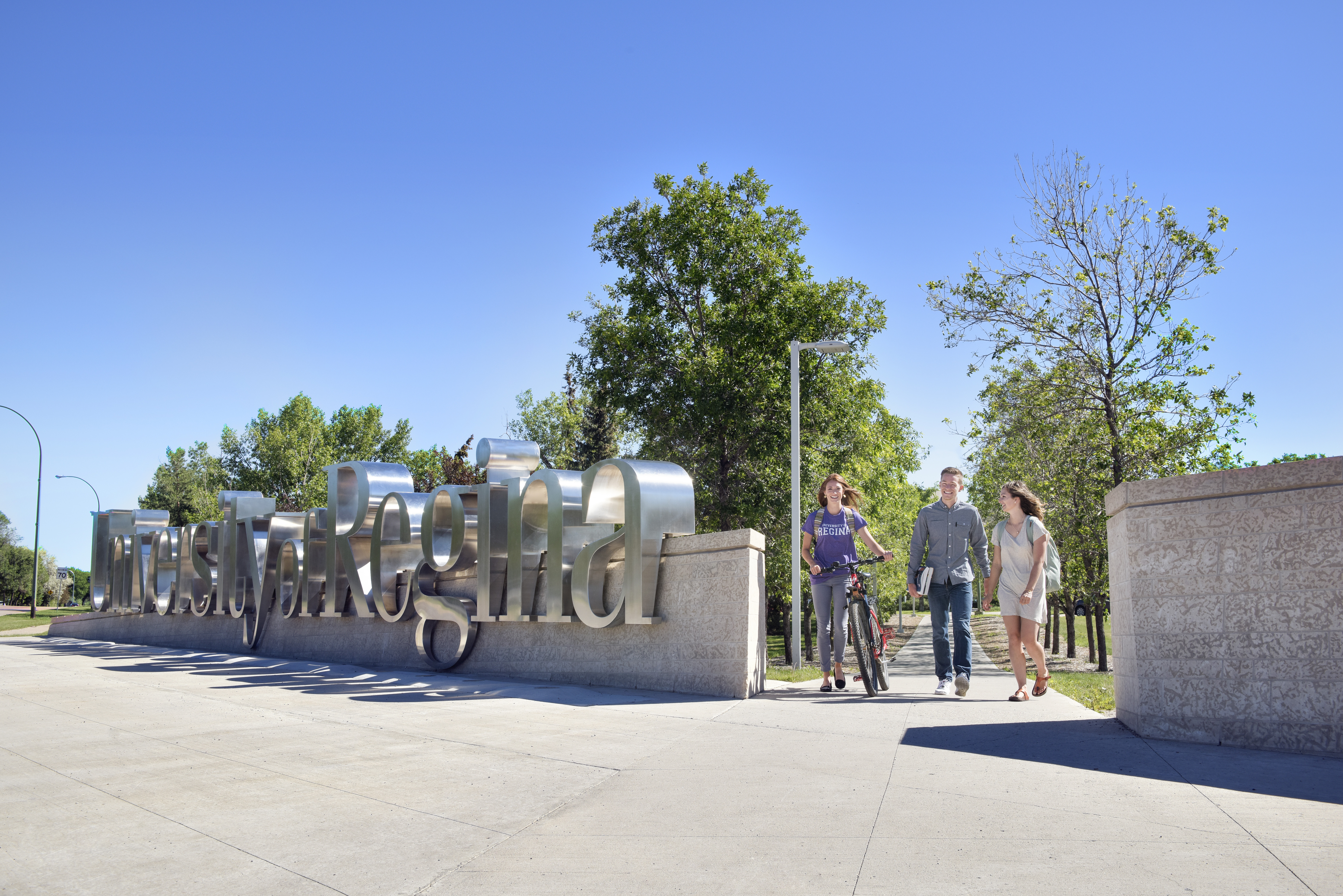 students by U of R sign