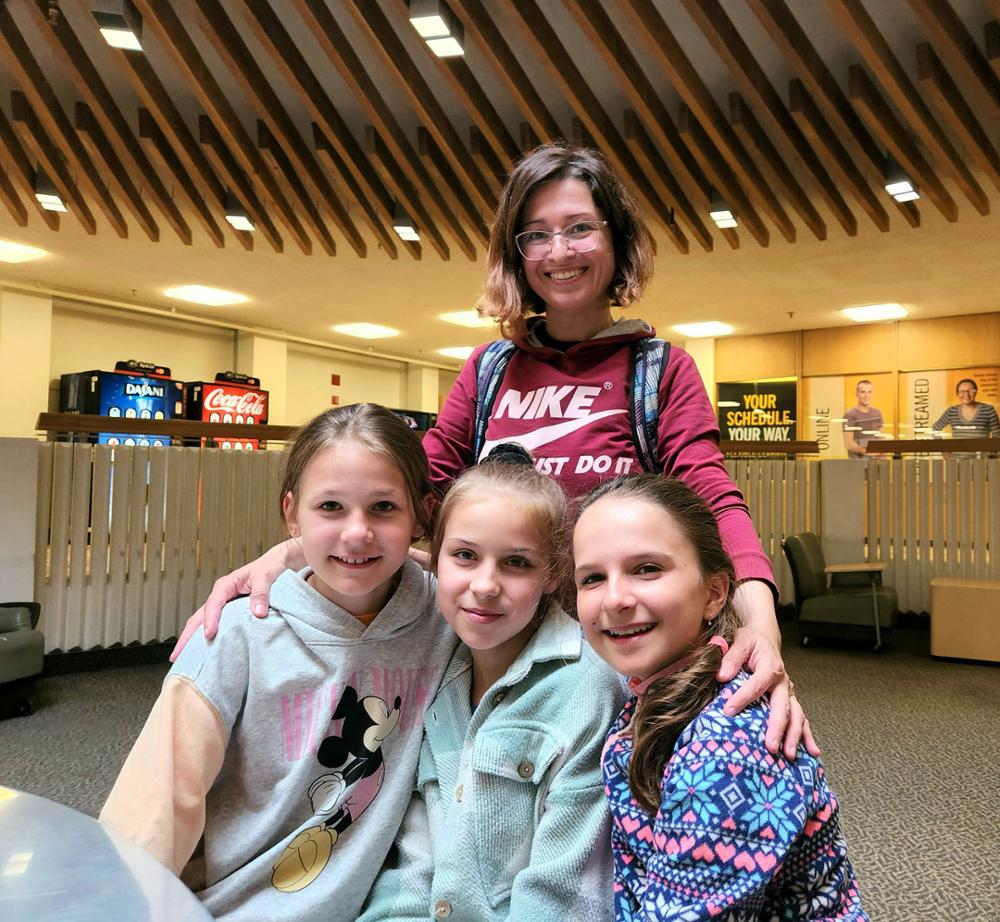 Three Prairie Beginnings participants with program translator Oksana Shulska.
