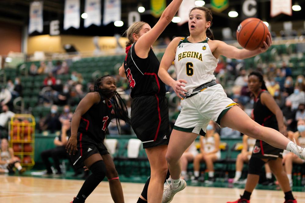 U of R Cougar basketball player on the court