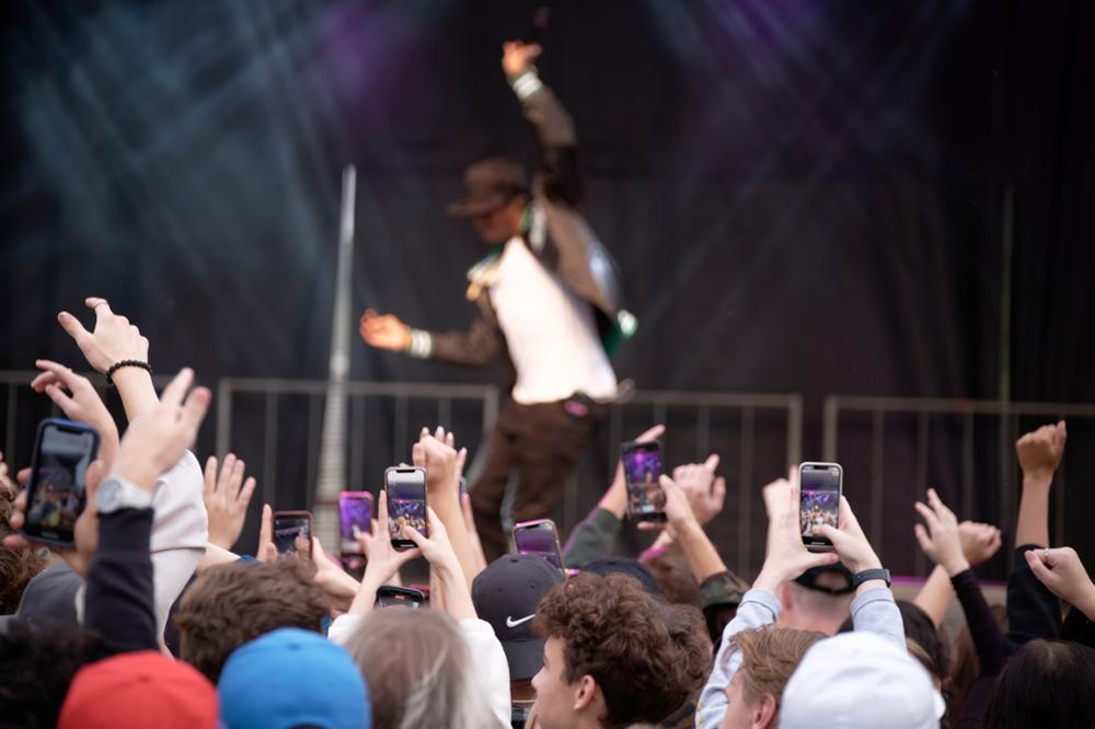 Canadian rapper Roy Wood$ performing on stage at Rams tailgate party.