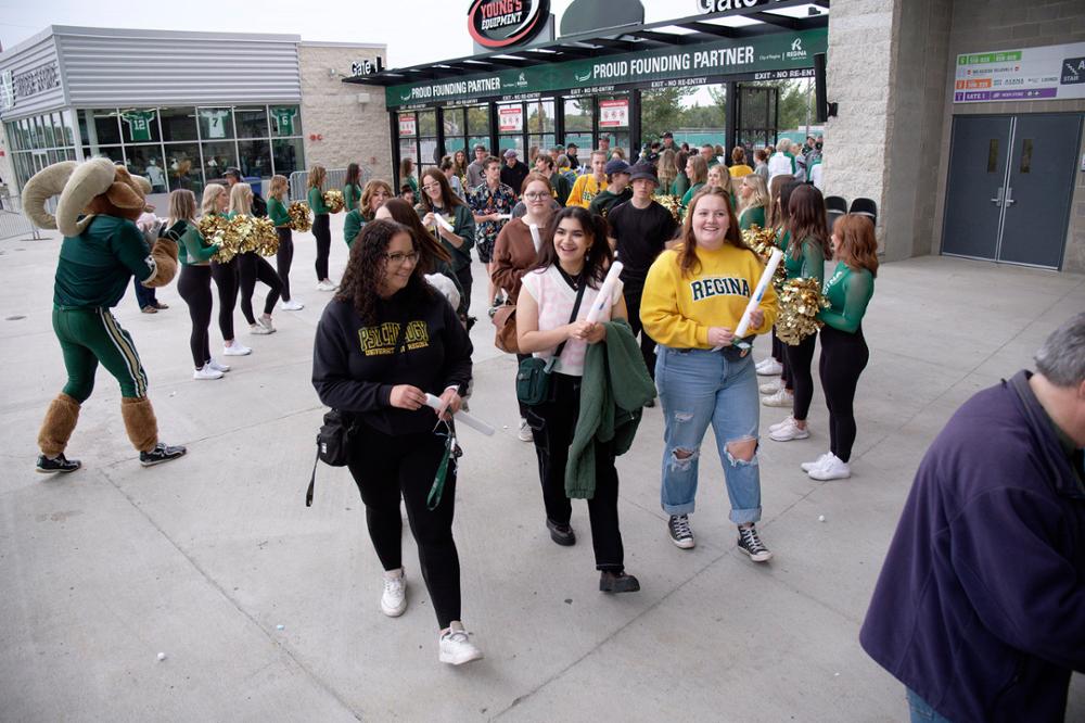 Fans arriving at Mosaic Stadium for Rams football game.