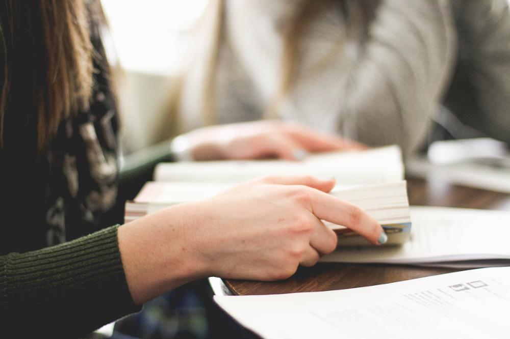 Hands holding a book