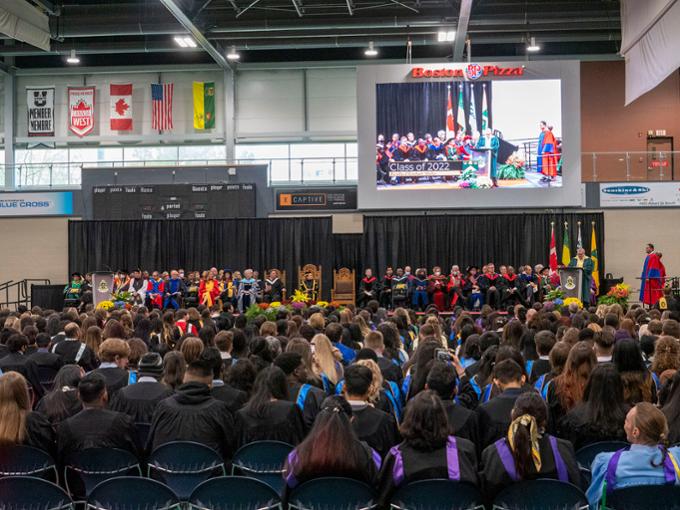 The crowd, as seen from the back of the room, of the convocation ceremony.