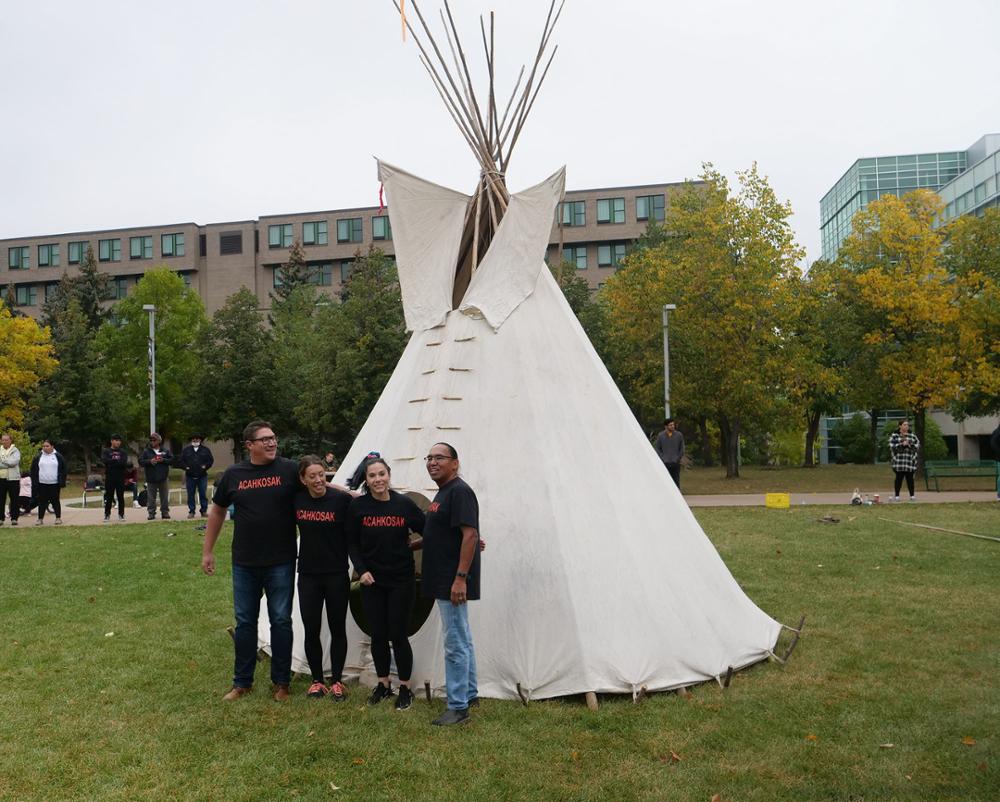 A happy team with their completed tipi! Credit: University Advancement and Communications.