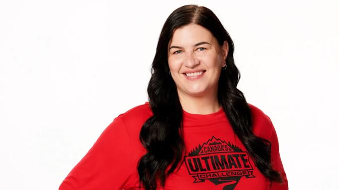 A woman poses for the camera against a pure white background.