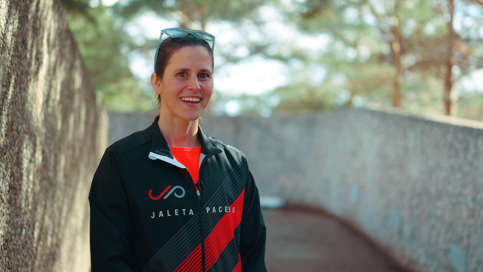 Dr. Julia Totosy de Zepetnek in her running team jacket.