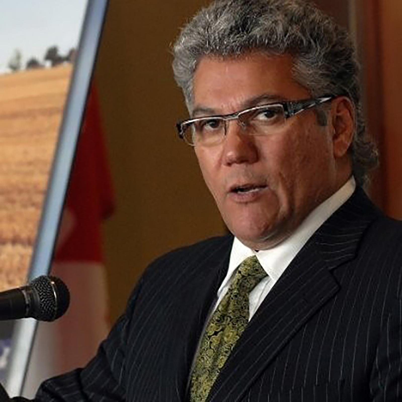 A man speaks at a podium