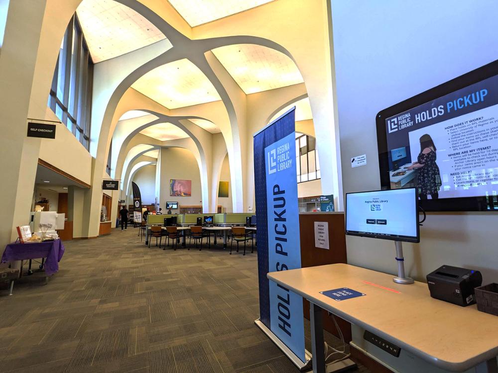 computer station used to check out library materials inside of library