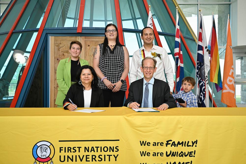 Six individuals at a table.