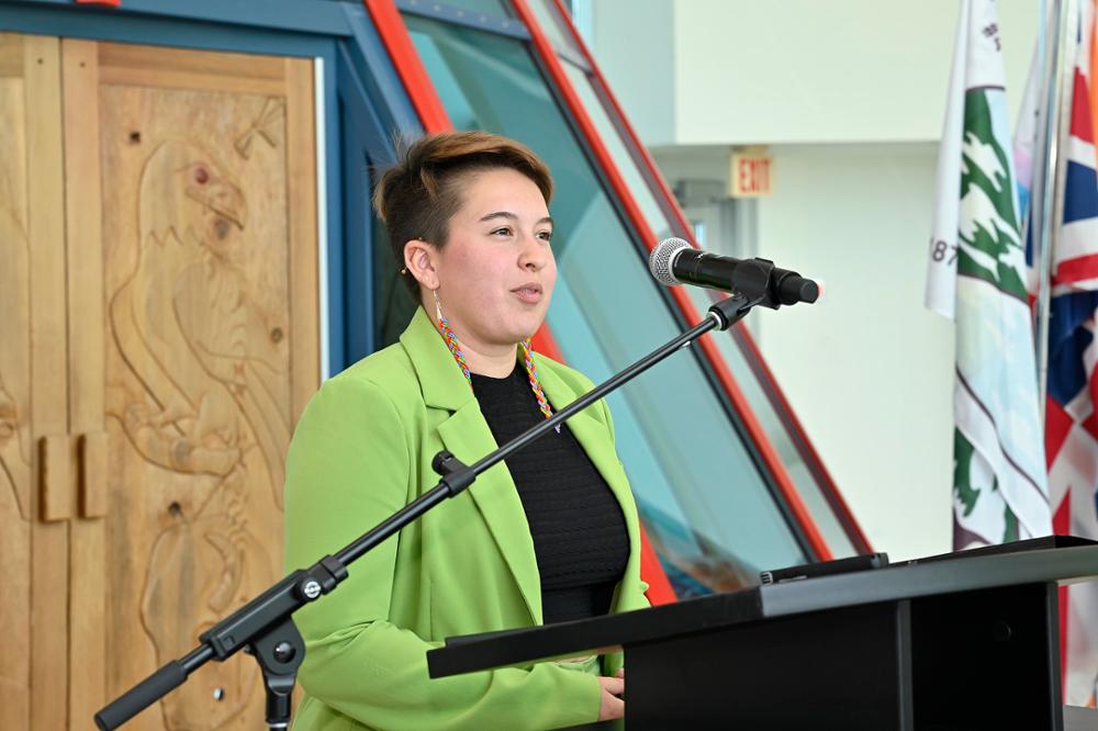 An individual speaking at a podium.