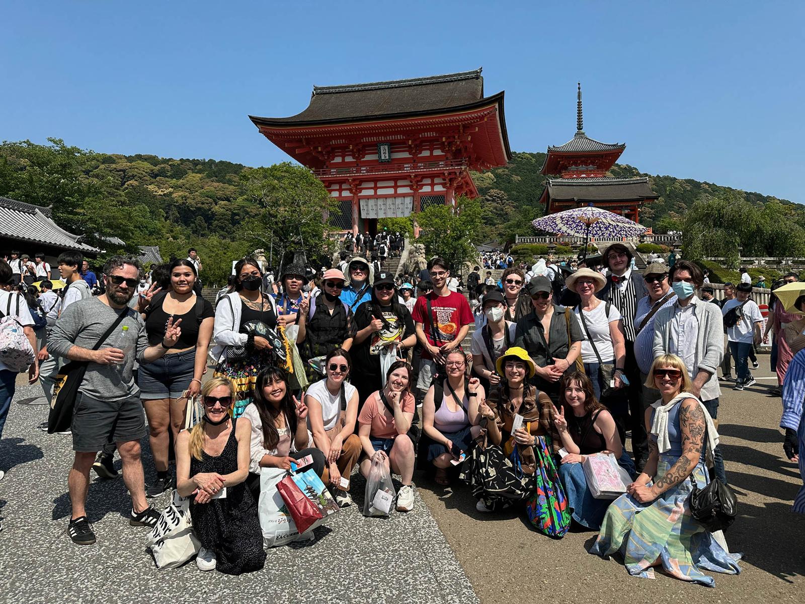a group of students at a temple in Japan.