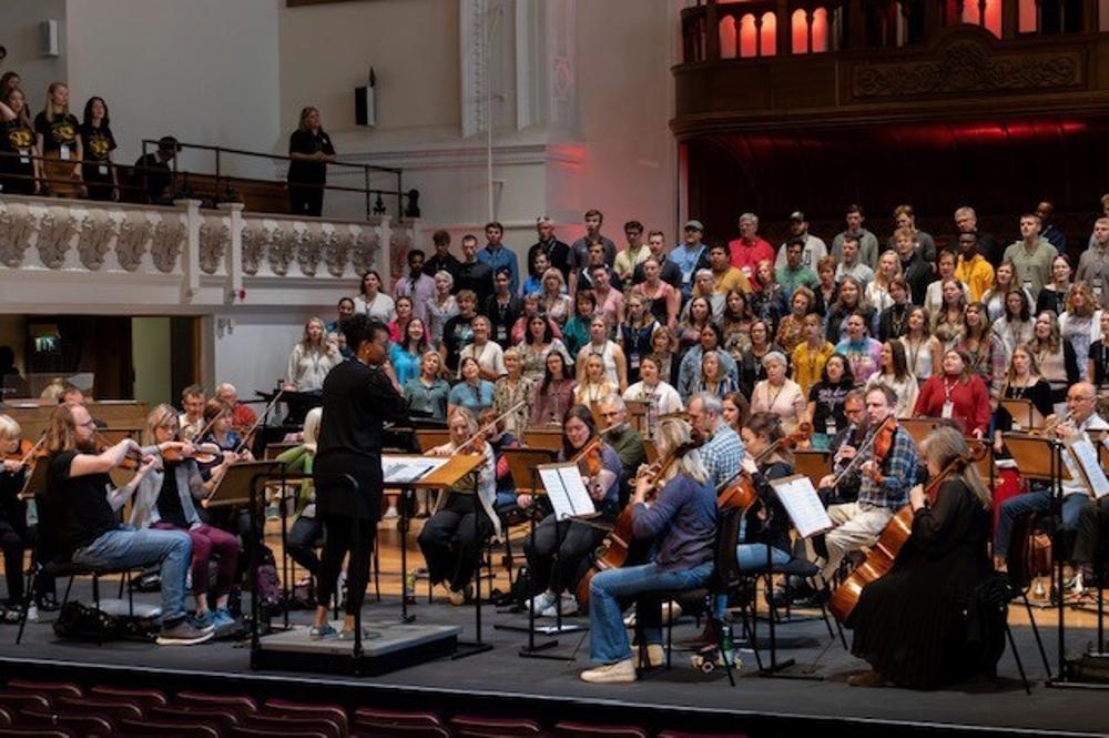 Students sitting in the audience at a concert hall