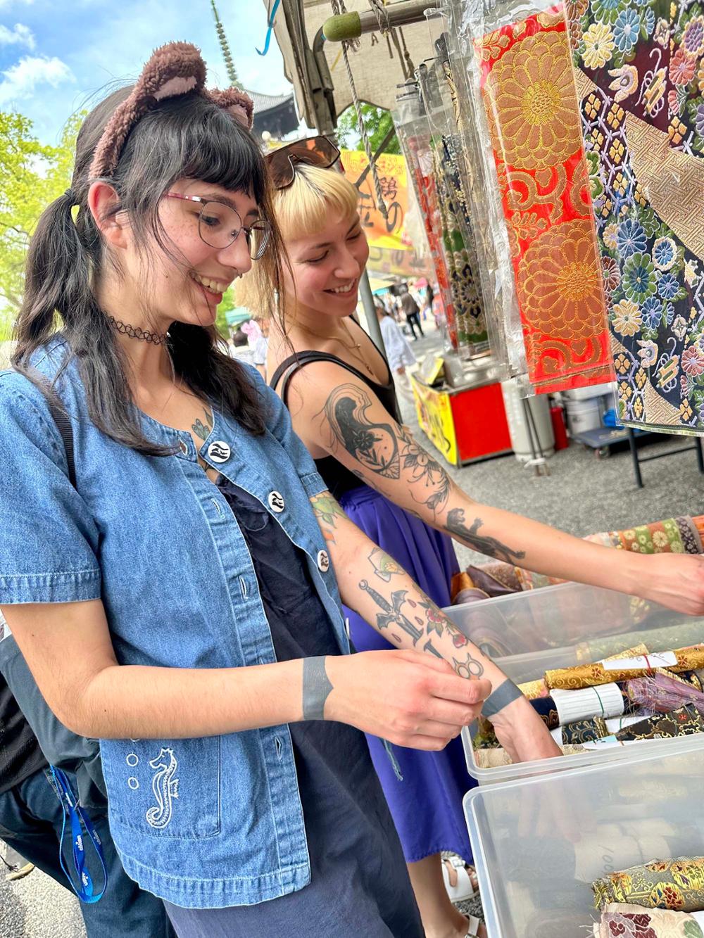 Two students at an outdoor market