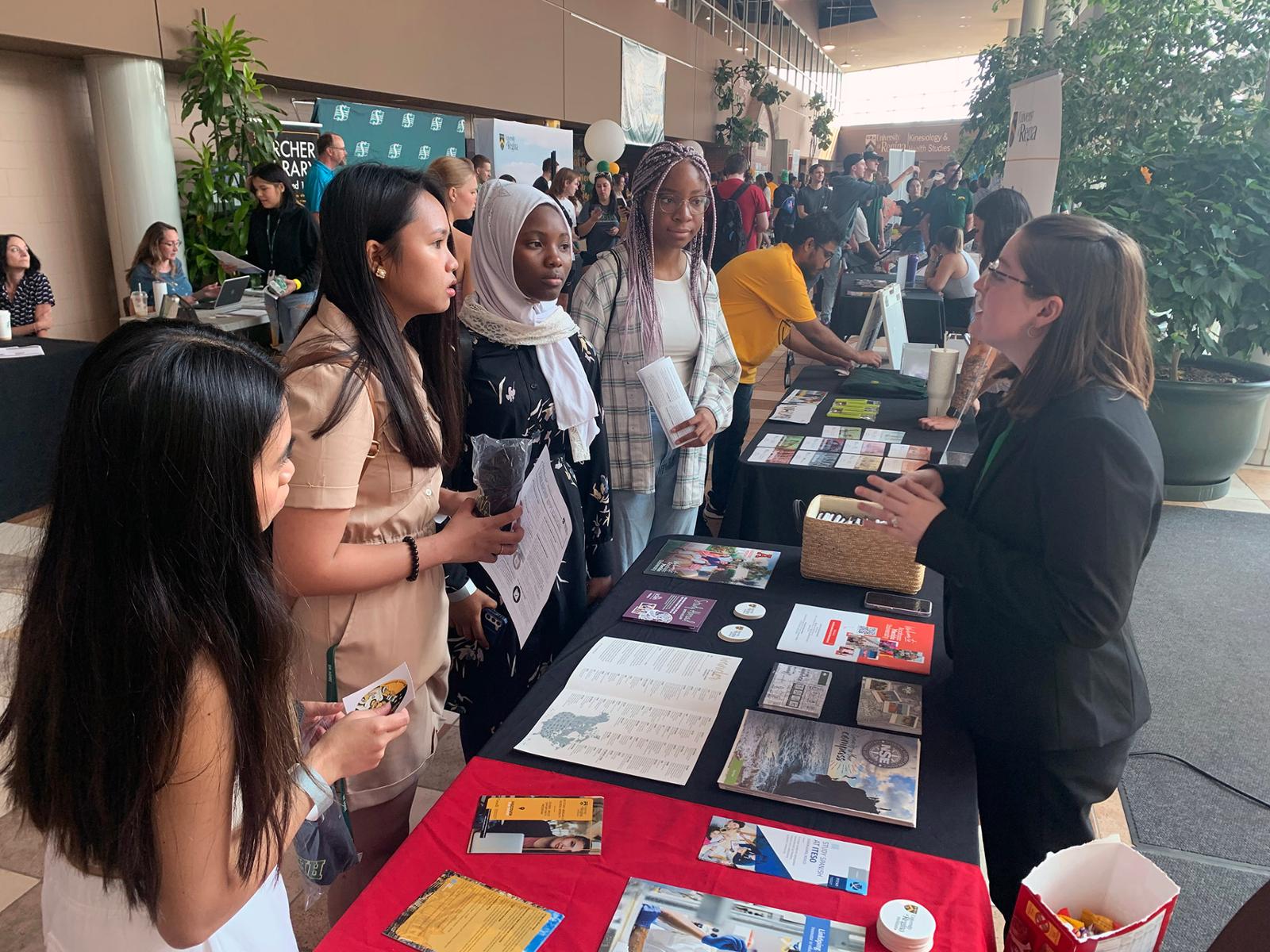 four students seek information at orientation 