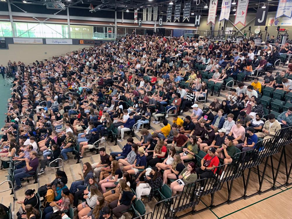 students pack the stands in the gymnasium bleachers