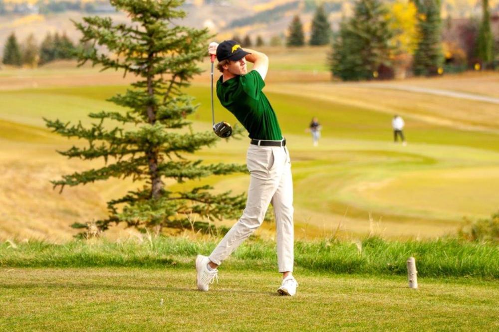 Golfer driving off the tee