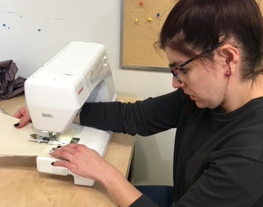 woman using a sewing machine