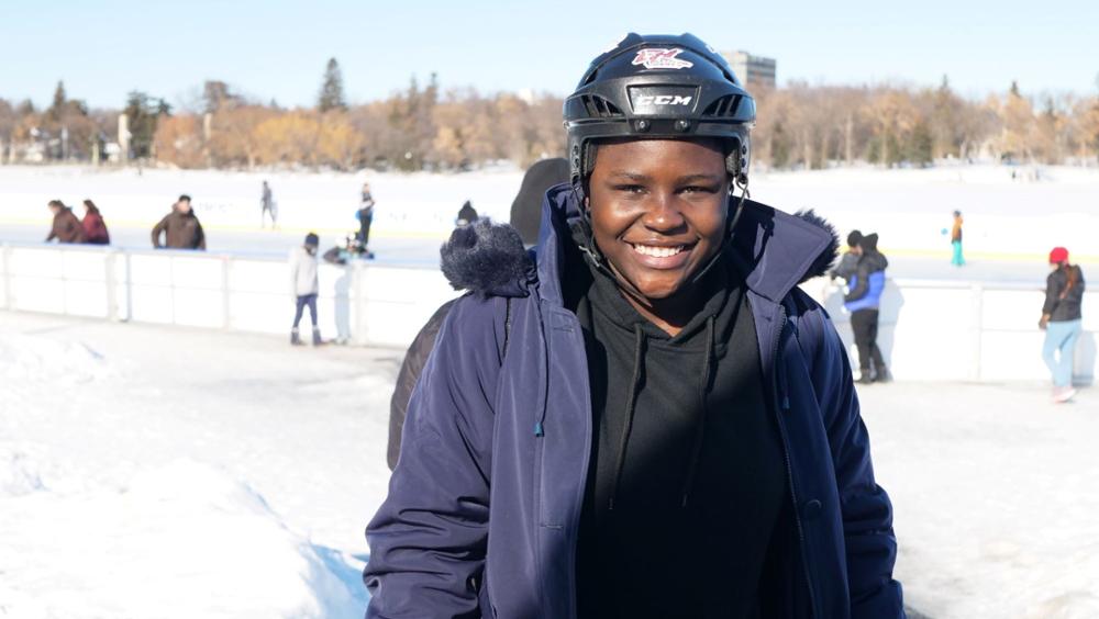 a smiling student on a skating rink
