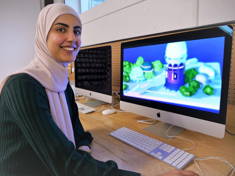 A student working on design on a computer