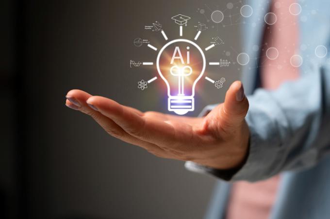 graphic of a person holding a lightbulb, representing an idea