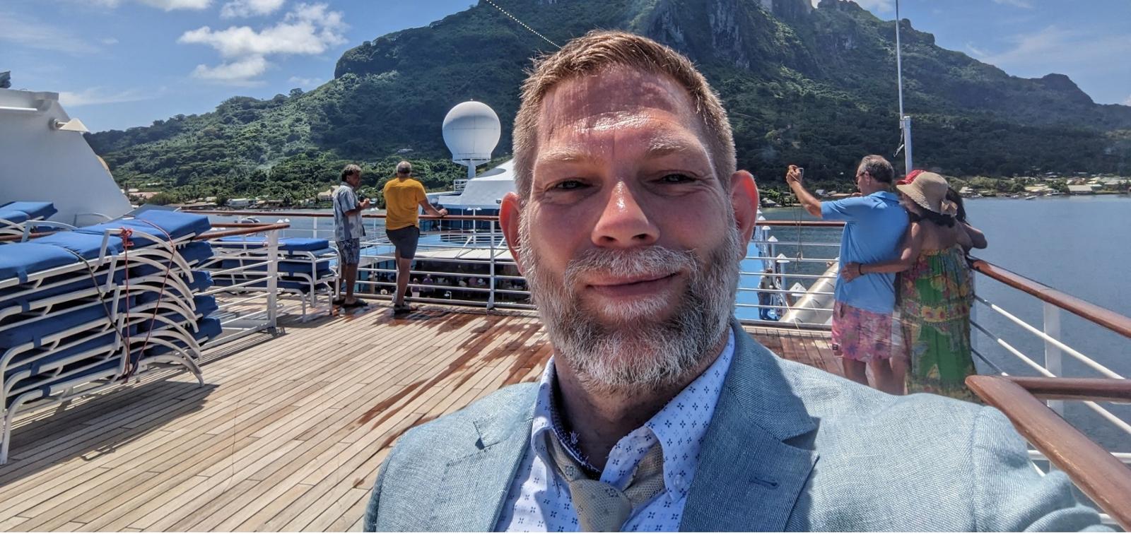 a man on a dock smiling