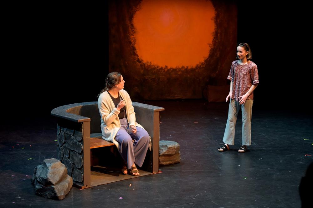 Two actors on stage in a play.