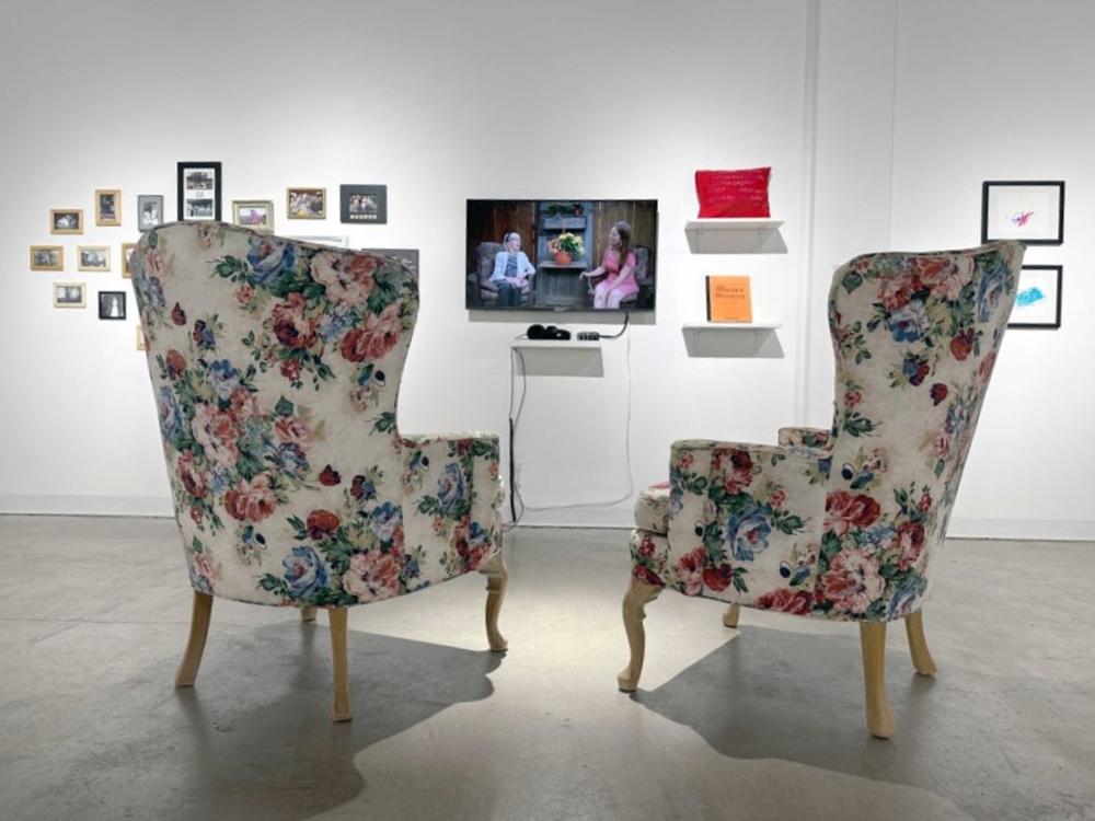 Two empty chairs facing a television