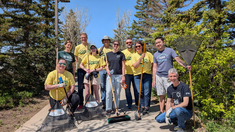 a group of people cleaning up campus