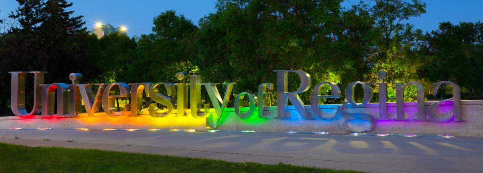 U or R sign lit by pride colours