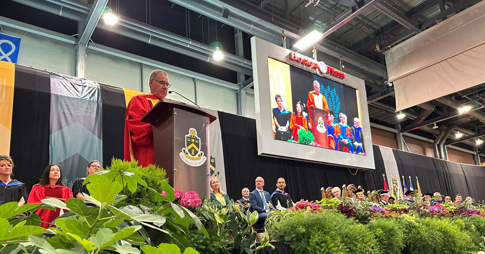 a man speaking at a podium