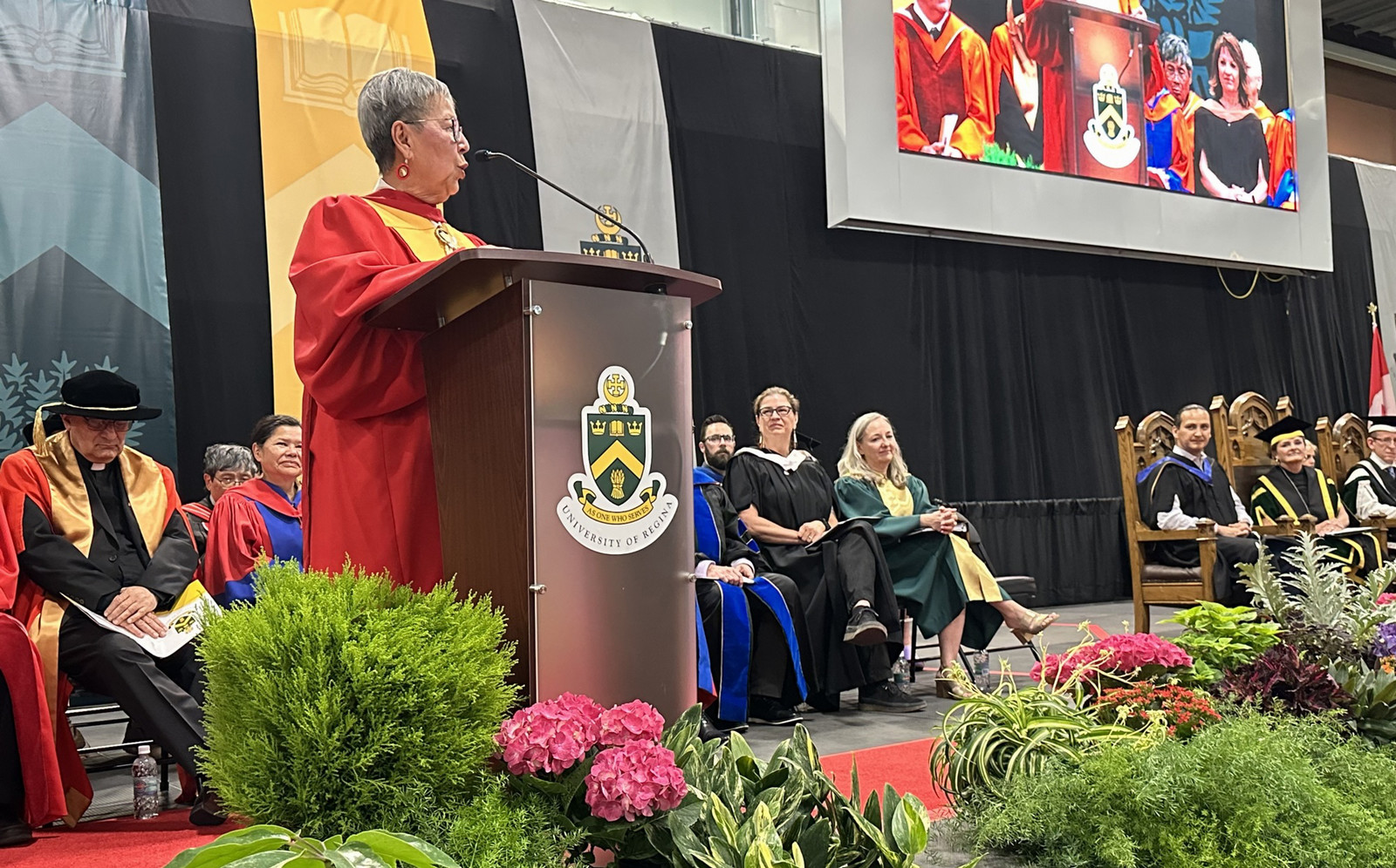 person speaking at a podium