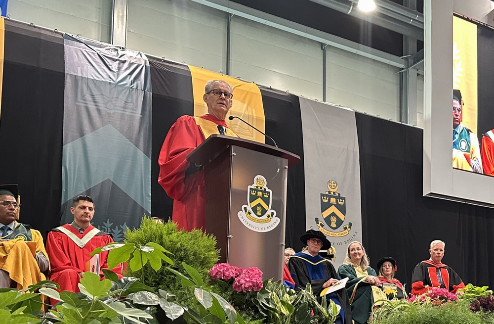 a man speaking at a podium