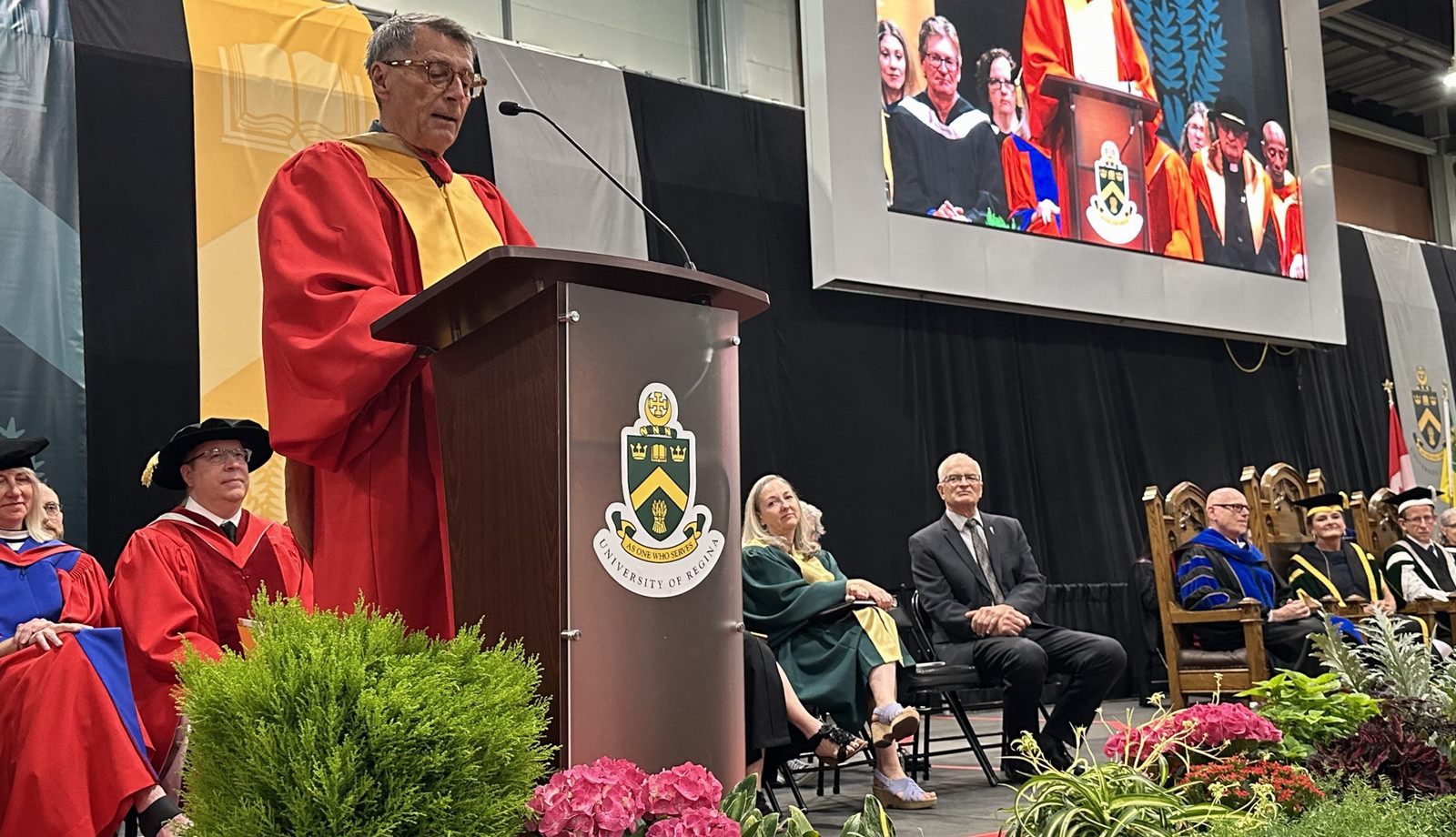 a man speaking at a podium