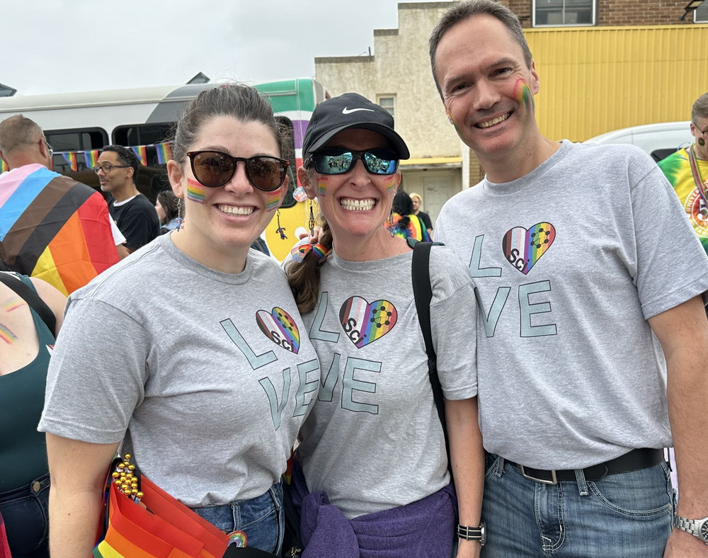three people smiling