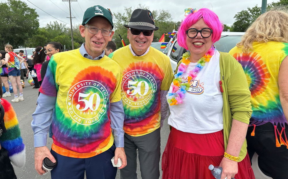 three people smiling