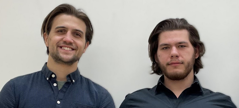 two men posing for a photo
