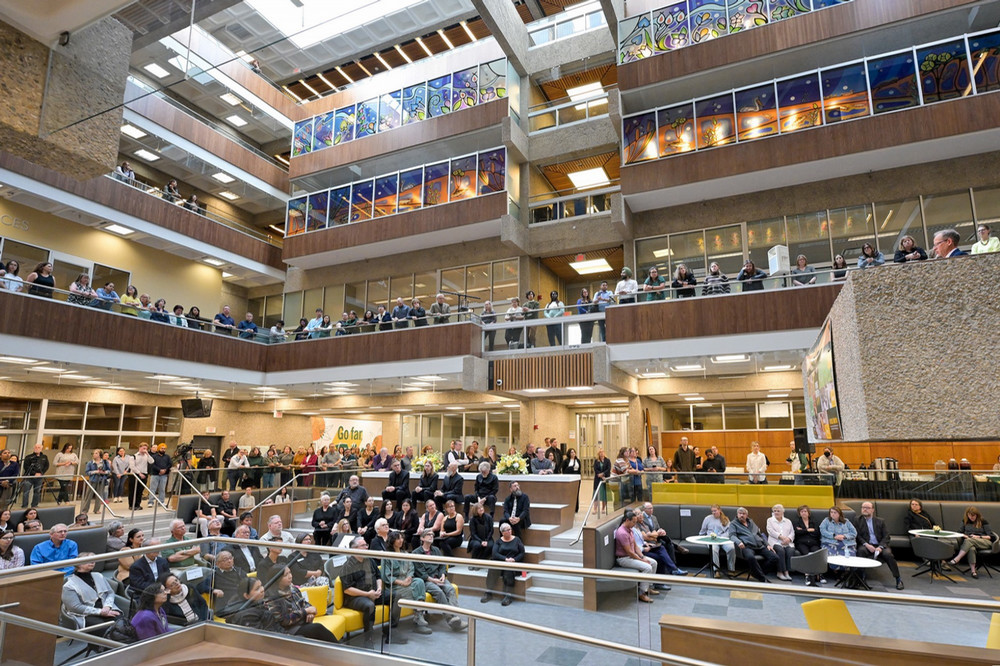 people sitting in a shared space in a large building