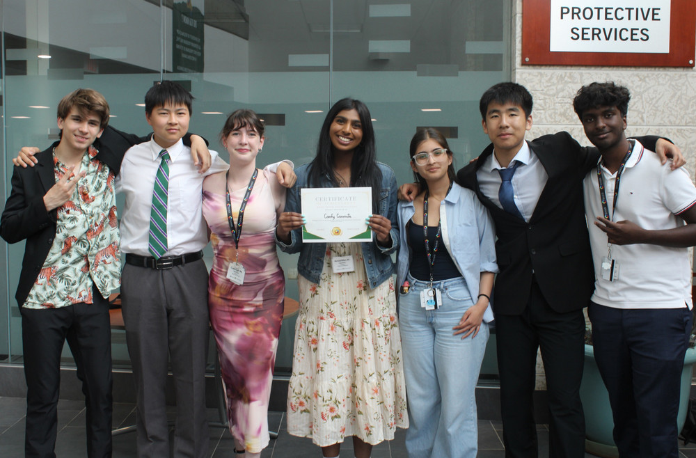 a group of seven students posing for a photo