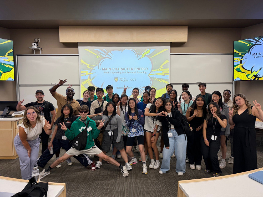 a large group of students posing in a classroom