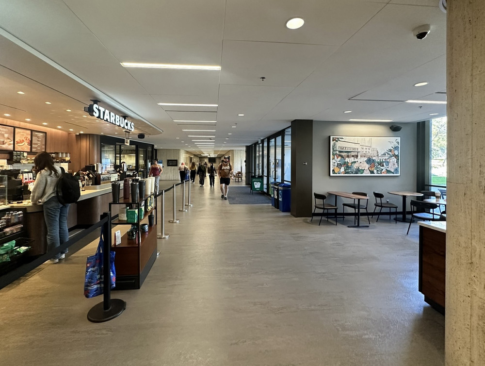 a hallway with a coffee shop