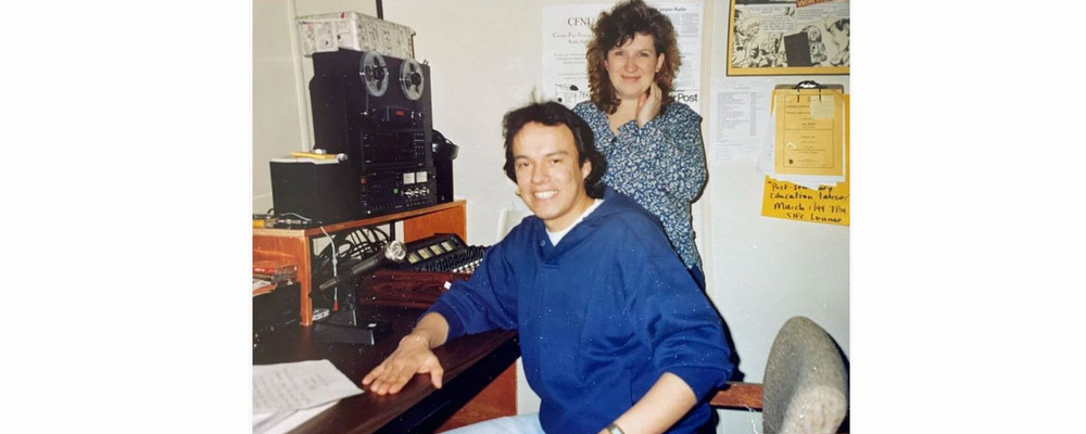 Two individuals in a radio station studio