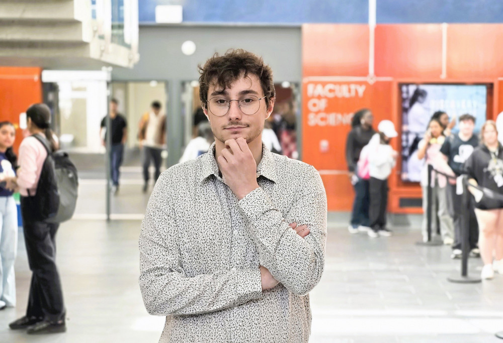 a man posing in a hallway