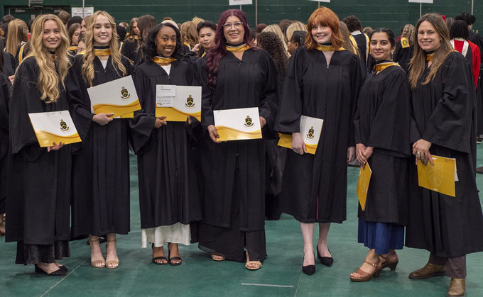 a group of students wearing gowns at convocation