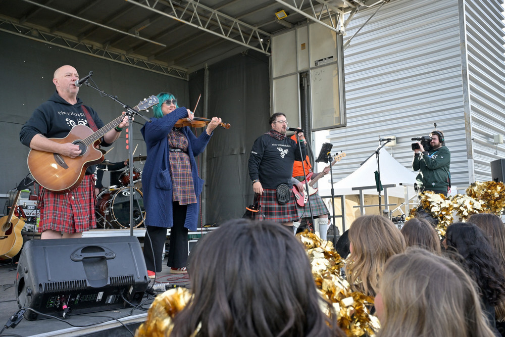 Musicians on an outdoor stage.