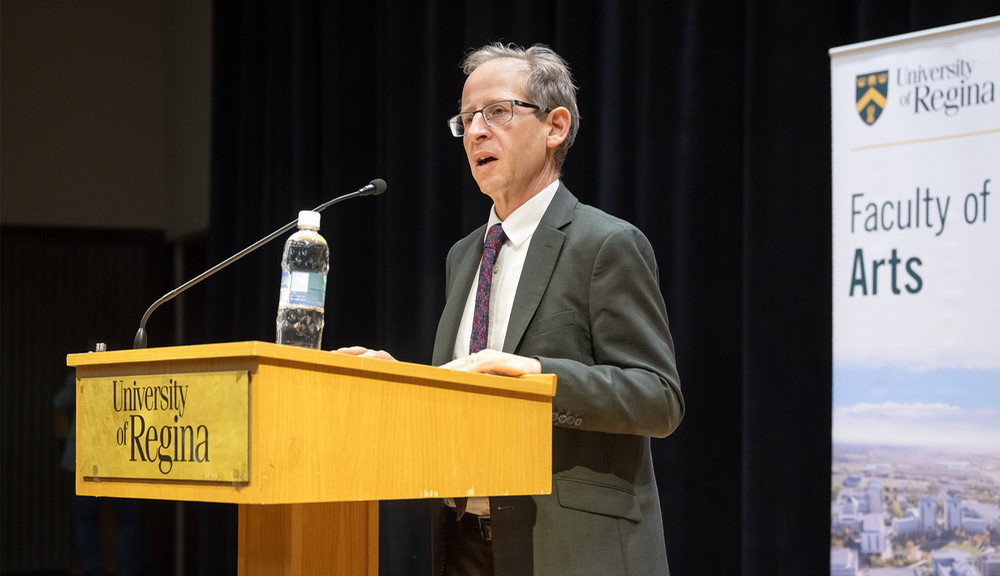 a man speaking at a podium