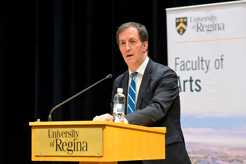 a man speaking at a podium