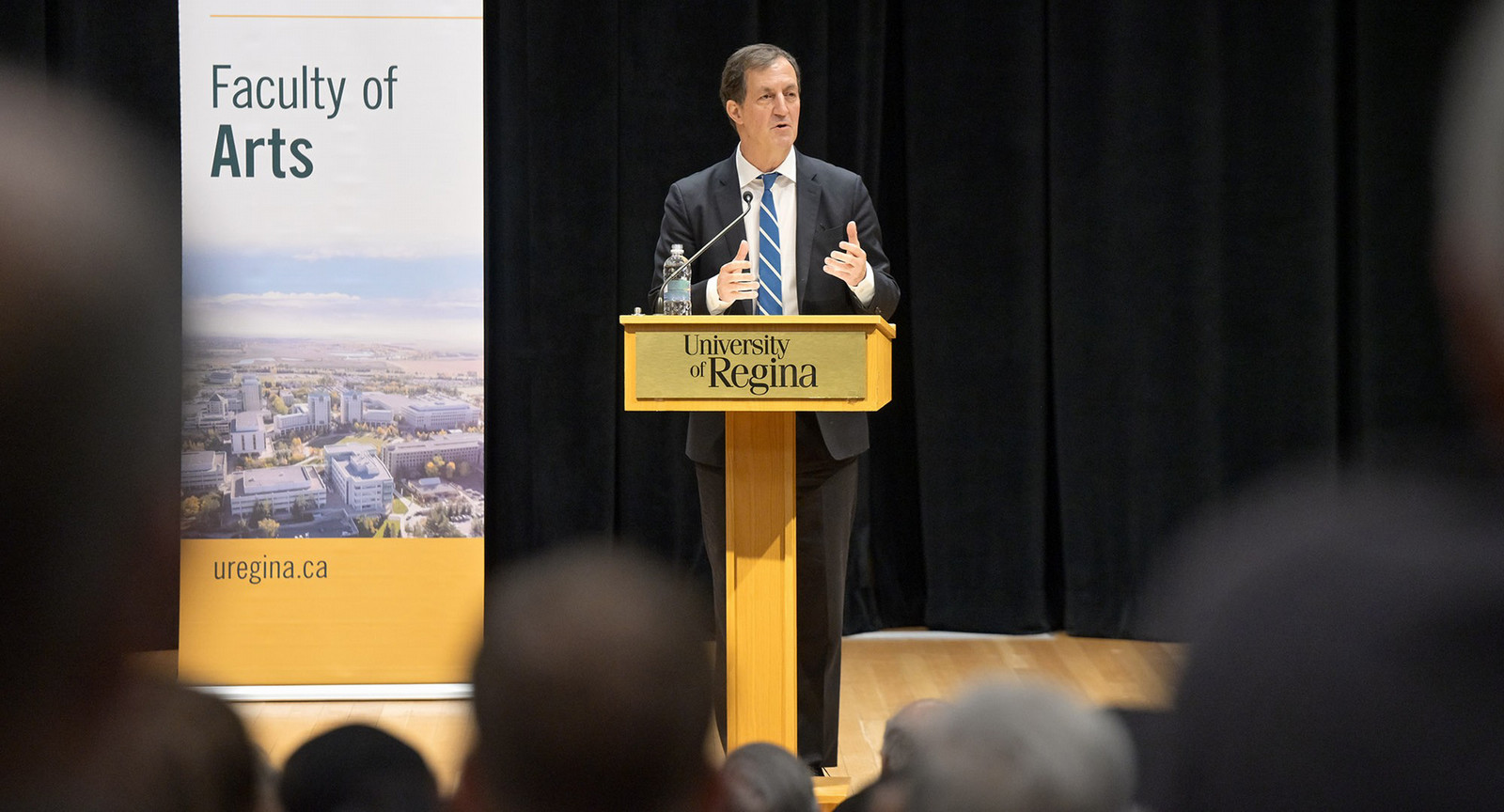 a man speaking at a podium