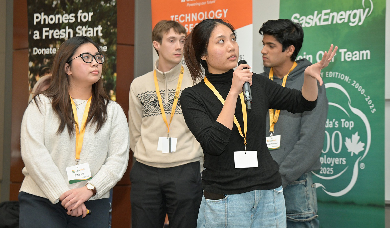 Four students presenting an idea