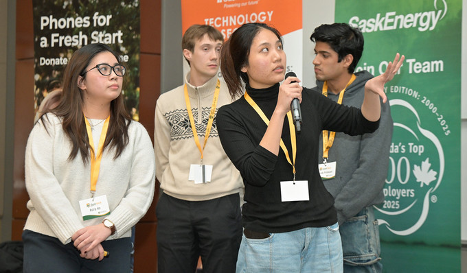 Four students presenting an idea